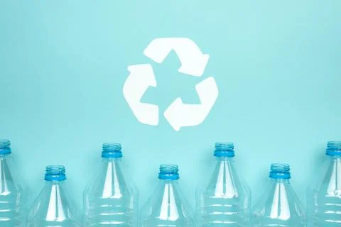 Clear plastic bottles without caps on a blue background. Recycling and enviro Foto stock