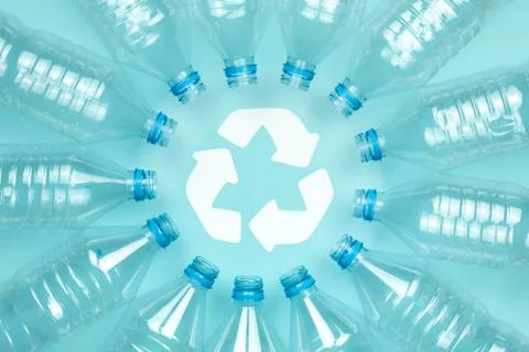 Clear plastic bottles without caps on a blue background. Recycling and enviro Stock Photos