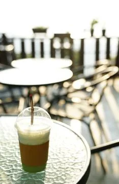 Clear plastic cup or disposable cup for beverages with straw and sphere dome  Stock Photos