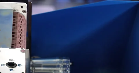 Clear plastic cups transported by moving conveyor belt in production workshop Stock Footage 341863982