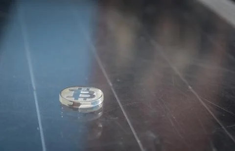 Clear plastic custom bit coin in nature Fotos de archivo