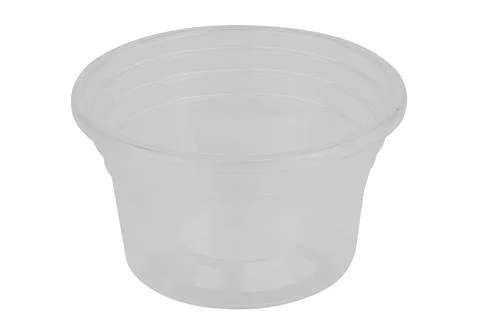 Clear plastic dipping sauce cups stacked on a white background Stock Photos