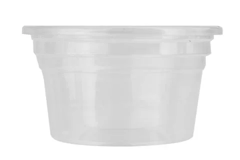 Clear plastic dipping sauce cups stacked on a white background Stock Photos