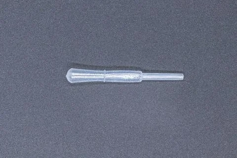 Clear Plastic Pipette for Precision Liquid Measurement in Laboratories Stock Photos