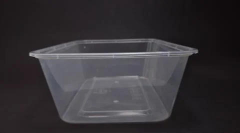 Clear plastic storage box rectangular shape, black background Stock Photos