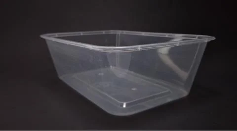 Clear plastic storage box rectangular shape, black background Stock Photos