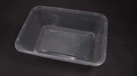Clear plastic storage box rectangular shape, black background Stock Photos