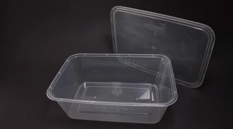 Clear plastic storage box rectangular shape, black background Foto stock