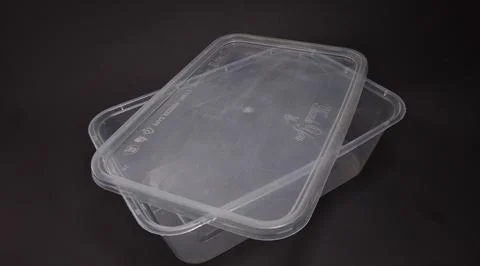 Clear plastic storage box rectangular shape, black background Stock Photos