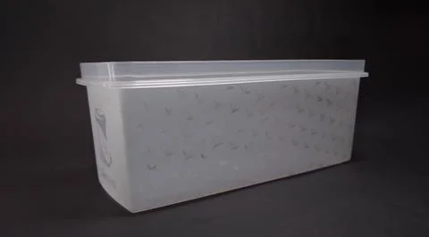 Clear plastic storage box rectangular shape, black background Stock Photos