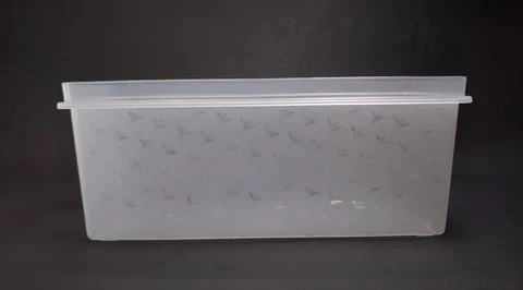 Clear plastic storage box rectangular shape, black background Stock Photos