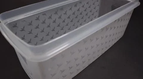 Clear plastic storage box rectangular shape, black background Foto stock