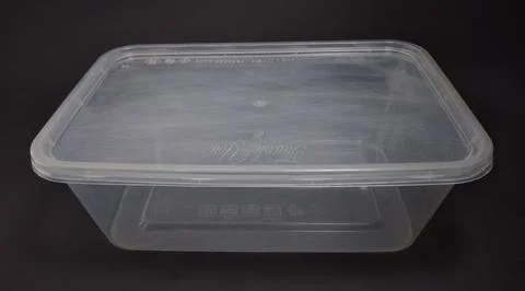 Clear plastic storage box rectangular shape, black background Stock Photos