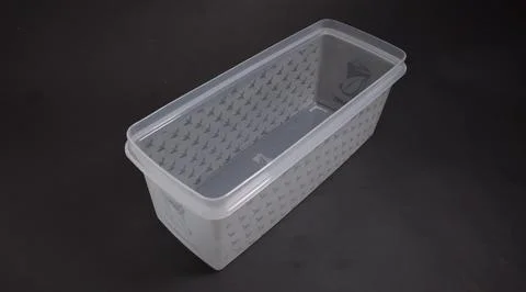 Clear plastic storage box rectangular shape, black background Stock Photos
