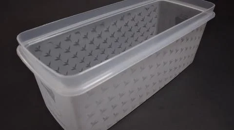 Clear plastic storage box rectangular shape, black background Stock Photos