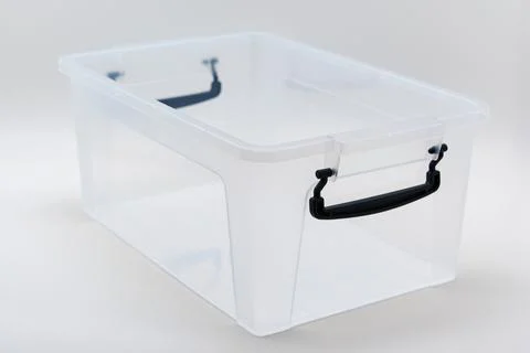 Clear plastic storage container without lid on white background Stock Photos
