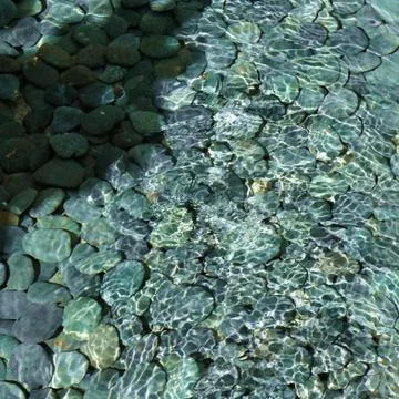 Clear Pond of Pebbles Stock Photos