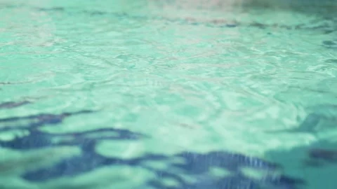 Clear pool water. Turquoise fresh water in the pool on a hot day. Light ripples Stock Footage 134516153