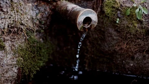 Clear potable raw water source. Spring water chute, pure mineral water gutter. Stock Footage 117154045