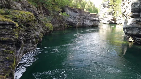Clear River Flow between Rocky Cliffs, Oppdal Norway Stock Footage 318532361