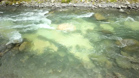 Clear River Flowing Over Submerged Boulders And Pebbles Stock Footage 327301259