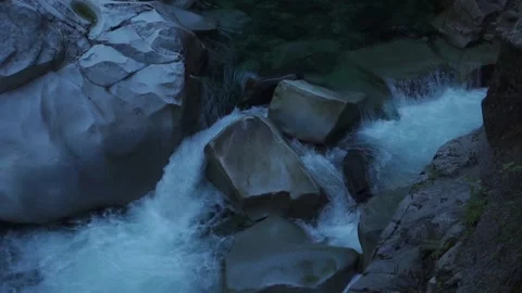 Clear River Flowing Through Large Rocks Stock Footage 232051136