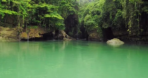 Clear River Pool in Tropical Canyon with Surrounding Jungle Aerial Stock Footage 332606731