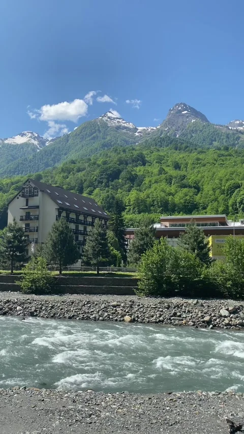 Clear river with powerful current flows through valley Stock Footage 277562468