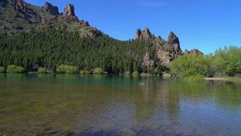 Clear river with rugged background Stock Footage 73214299