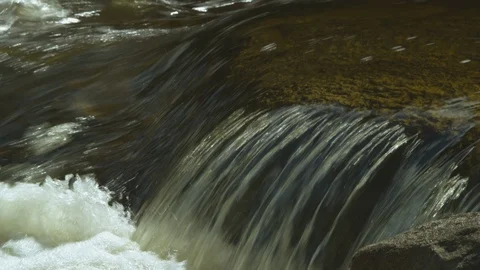 Clear river water flowing over the rock Stock Footage 103824653