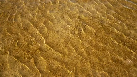 Clear sand pattern waves in shallow water on sea bottom Stock Footage 137460216