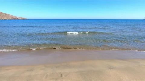 Clear sea waves reaching the sandy shore Stock Footage 271023415