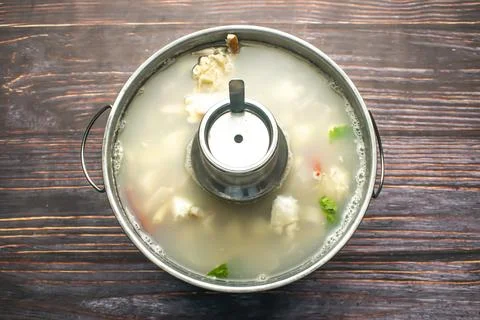 Clear Seafood Soup include steamed dumplings and shrimp served in broth iso.. Stock Photos