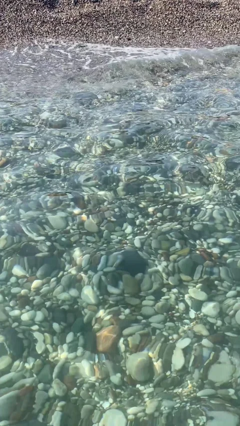 Clear Shallow Sea Water Flowing Over Colorful Pebbles 動画素材 346502964