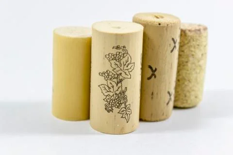 Clear shot of multiple wine corks with blurry white background Stock Photos