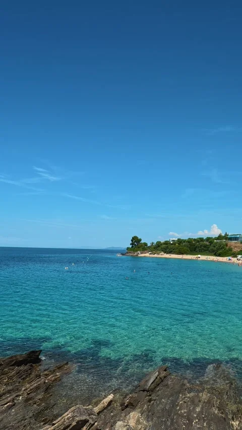 Clear sky above calm turquoise sea. Lagomandra, Greece. Vertical Stock Footage 339626617