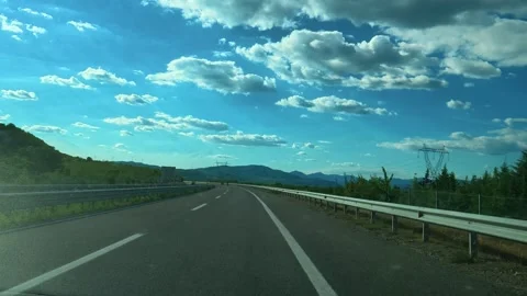 Clear sky above highway with distant hills. Macedonia 스톡 동영상 340638606