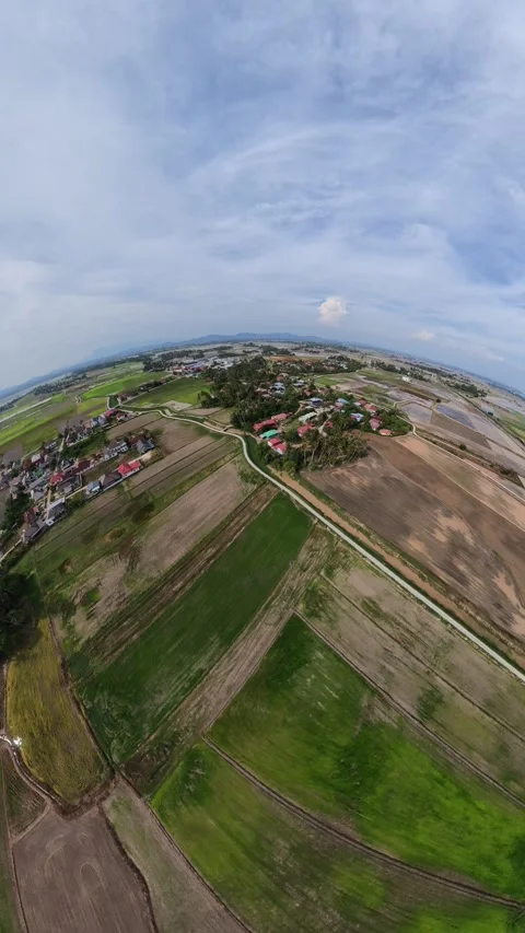Clear sky above patchwork farmland Stock Footage 345409547