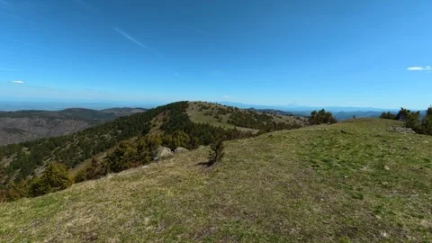 Clear sky above rolling green hills. Balkan, Eastern Europe, POV Stock Footage 333440875