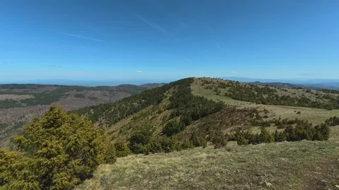 Clear sky above rolling green hills. Balkan, Eastern Europe, POV Video stock 333441485