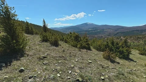 Clear sky above rugged mountains and green hills. Balkan, Eastern Europe, POV Vídeos de archivo 333440279