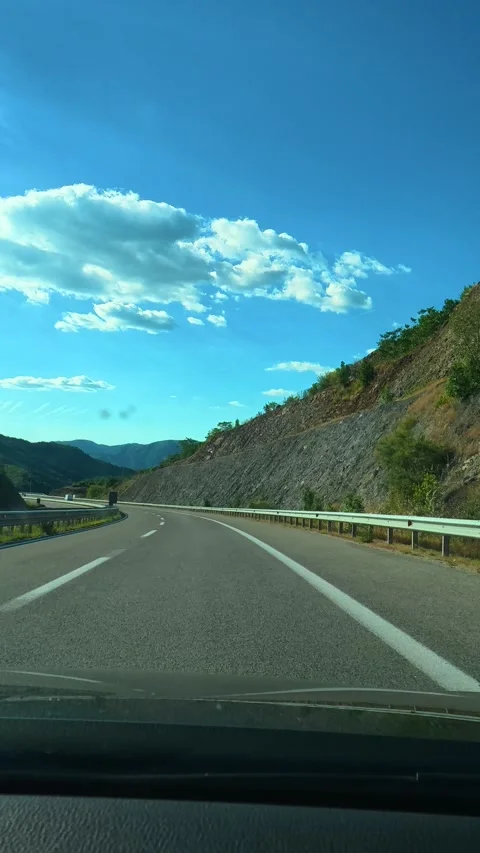Clear sky above winding highway through mountains. Macedonia, Vertical Stock Footage 340652338