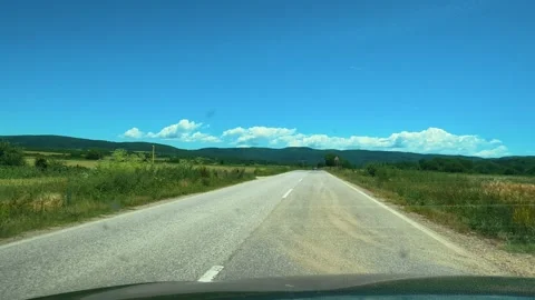 Clear sky above winding road through green fields. Mount Rtanj Area, Serbia Stock Footage 340897412