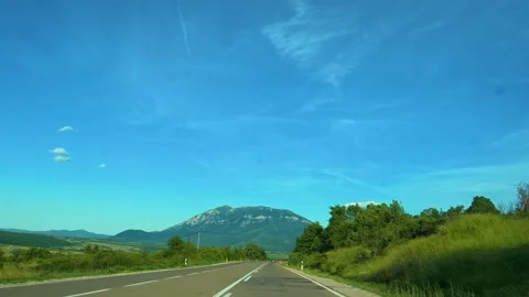 Clear sky above winding road through green hills. Mount Rtanj Area, Serbia Stock Footage 340897592