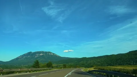 Clear sky above winding road through green hills. Mount Rtanj Area, Serbia Stock Footage 340898000