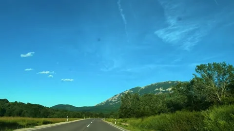 Clear sky above winding road through green hills. Mount Rtanj Area, Serbia Stock Footage 340898283
