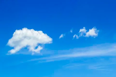 Clear sky and fluffy cloud Stock Photos