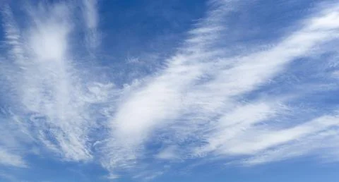 Clear sky with cloudscape clouds. Blue sky holds fluffy clouds. Summer sky .. Stock Photos