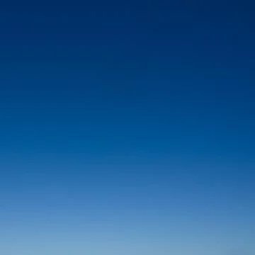 Clear sky as gradient or background. Azure sky without clouds. Stockfoto's