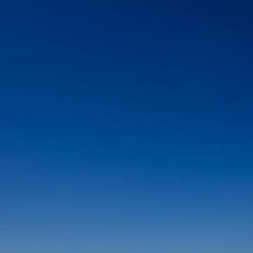 Clear sky as gradient or background. Azure sky without clouds. Stock Photos